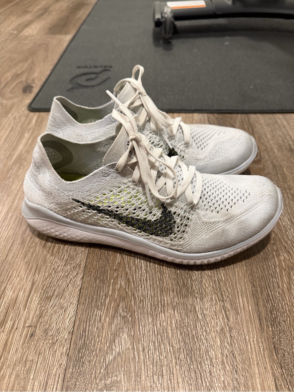 Nike Women's White Flyknit Running Shoes with Black Swoosh